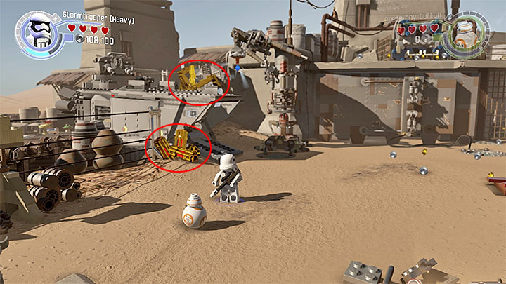 Special requirements: a character capable of destroying golden objects (like a stormtrooper with a heavy blaster), a character capable of using handles (like Chewbacca) - Chapter 3 - Niima Outpost | Minikits and red bricks - Minikits and red LEGO bricks - LEGO Star Wars: The Force Awakens Game Guide