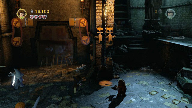 You need to prepare yourself for a fight - start off by strengthening the door by using the weapons lying on both sides - The Mines of Moria - Walkthrough - Act I - LEGO The Lord of the Rings - Game Guide and Walkthrough