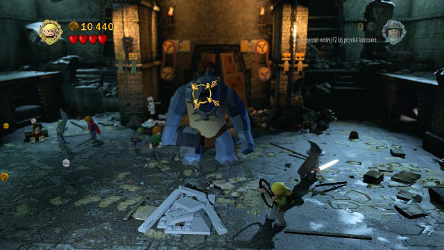 One of the hobbits will jump on the troll's back - after a couple hits (H) the troll will be stunned - you can use this chance to change to Legolas and shoot an arrow at him - The Mines of Moria - Walkthrough - Act I - LEGO The Lord of the Rings - Game Guide and Walkthrough