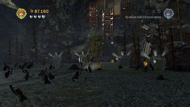 Directly by the dam you will find a few boulders on the ground - Osgiliath - Walkthrough - Act II - LEGO The Lord of the Rings - Game Guide and Walkthrough