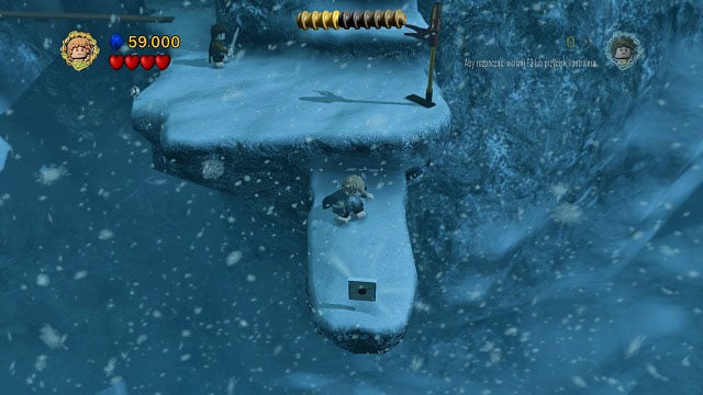 After crossing the bridge, avoid the strong winds and instead of going up the stairs, move towards the camera - The Pass of Caradhras - Collectibles - LEGO The Lord of the Rings - Game Guide and Walkthrough