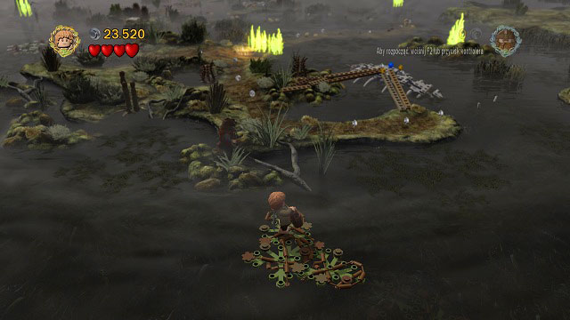 By the third wall of fire you have to head to the southern part of the island, towards the camera - The Dead Marshes - Collectibles - LEGO The Lord of the Rings - Game Guide and Walkthrough