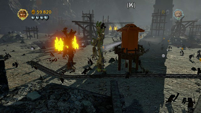 Head towards the camera - you should find a water tower which you can use to extinguish the nearby fire - Osgiliath - Collectibles - LEGO The Lord of the Rings - Game Guide and Walkthrough
