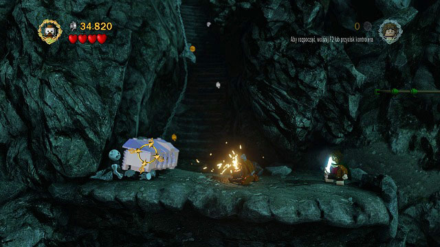 Avoid the precipice using the rail mounted to the wall and you should see a mithril chest - Secret Stairs - Collectibles - LEGO The Lord of the Rings - Game Guide and Walkthrough