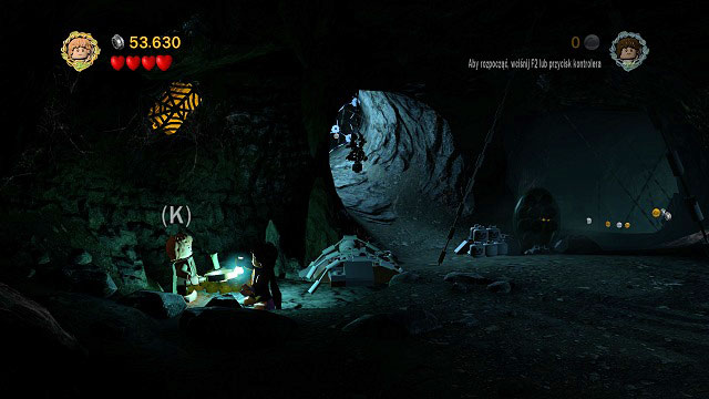 As you're going through the tunnels, in the first bigger room on the left you should see a Minikit behind a spider-web on the wall - Secret Stairs - Collectibles - LEGO The Lord of the Rings - Game Guide and Walkthrough