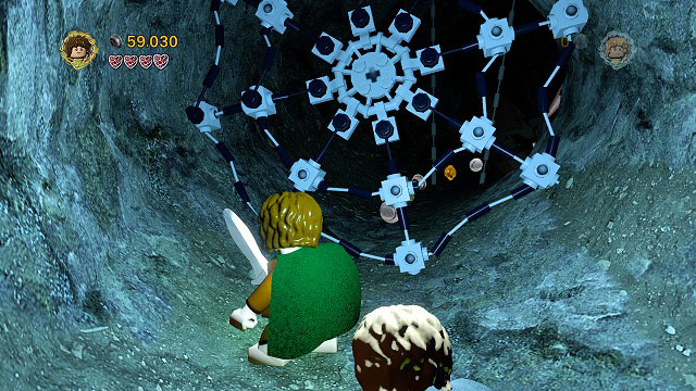 On the left side of the cave in which you found Minikit #6 there's a bright tunnel blocked by spider-web - Secret Stairs - Collectibles - LEGO The Lord of the Rings - Game Guide and Walkthrough