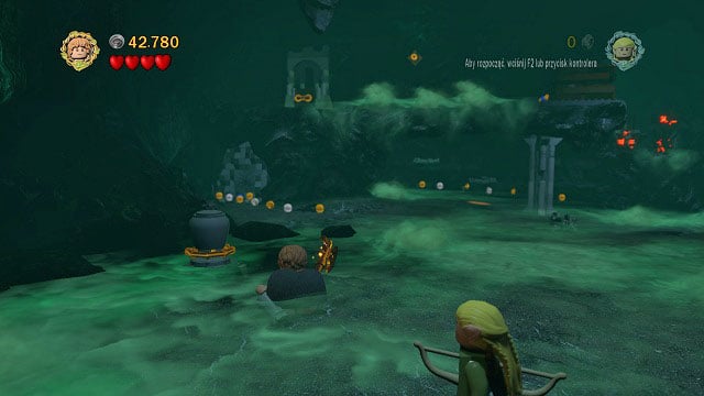 The obtained sacrifice has to be placed on the altar which you can receive after pulling the orange handle on a rock ledge in the same room - The Paths of the Dead - Collectibles - LEGO The Lord of the Rings - Game Guide and Walkthrough