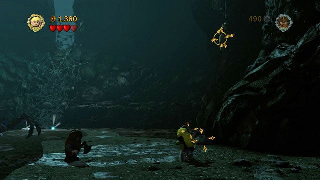 As you're fighting Shelob, you can find 5 cocoons hanging from the ceiling - Cirith Ungol - Collectibles - LEGO The Lord of the Rings - Game Guide and Walkthrough