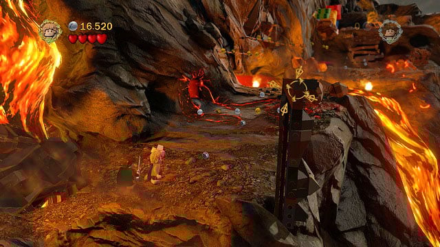 After stopping the river of lave, dig up another stone from the loose ground beneath you and throw it at the pillar on the right - Mount Doom - Collectibles - LEGO The Lord of the Rings - Game Guide and Walkthrough