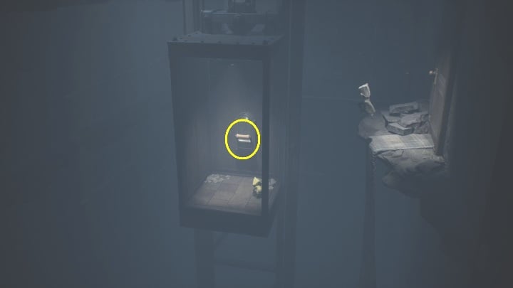 Six will show you how to hop down to the elevator - Little Nightmares 2: Crossing the city - Chapter 4 walkthrough - Chapter 4 - Getting to the Tower - Little Nightmares 2 Guide