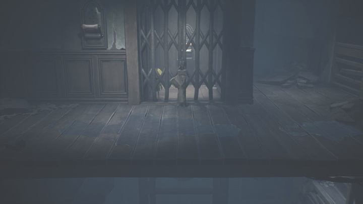 Head back to Six and release her from the elevator - Little Nightmares 2: Crossing the city - Chapter 4 walkthrough - Chapter 4 - Getting to the Tower - Little Nightmares 2 Guide