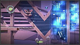 Once you jump over the electrified device, leap from the small ledge and bounce off the cans attached to the wall (to collect more items) - Avalon's Advanced Armaments Academy - Avalon - LittleBigPlanet 2 - Game Guide and Walkthrough
