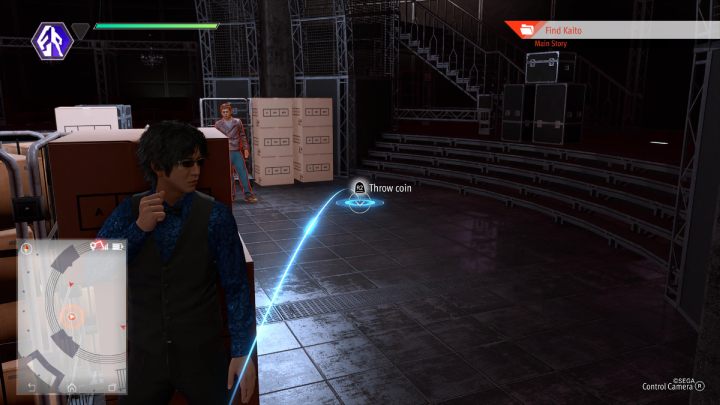 Walk to the designated spot on the floor, throw a coin to distract the standing man and proceed to the next checkpoint - Lost Judgment: Chapter 5 Double Jeopardy - walkthrough - Main storyline walkthrough - Lost Judgment game guide
