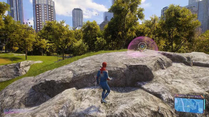 You'll find this Spider-bot on a large boulder in the middle of the park - Spider-Man 2: All Spider-bot locations - Secrets and Collectibles - Spider Man 2 Guide