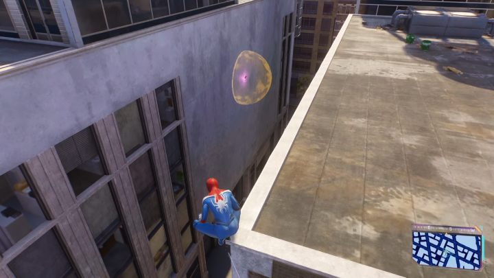 This Spider-bot is on one of of the walls of the building, near the rooftop - Spider-Man 2: All Spider-bot locations - Secrets and Collectibles - Spider Man 2 Guide