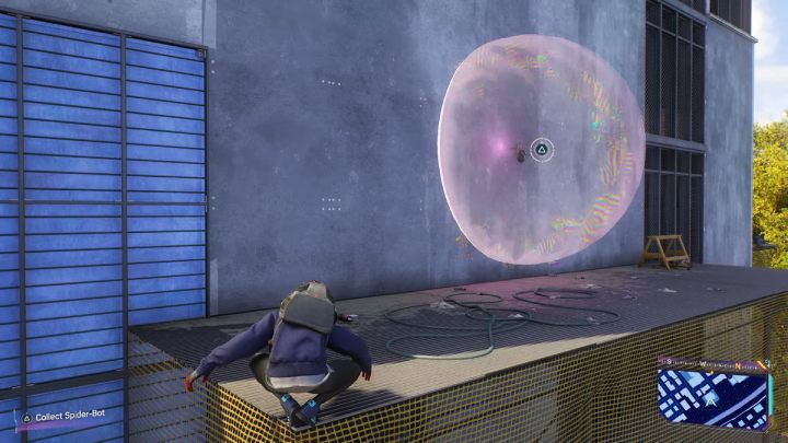 You'll find this Spider-bot on one of the walls of the building, near the scaffolding - Spider-Man 2: All Spider-bot locations - Secrets and Collectibles - Spider Man 2 Guide