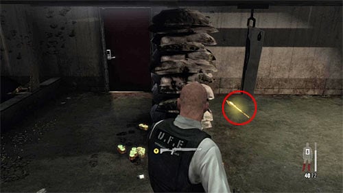 Walk round the bags with sand, and youll find the last part of a weapon in this chapter [Golden Gun - LAW 3/3] - Chapter XIII - p. 5 - Walkthrough - Max Payne 3 Game Guide & Walkthrough