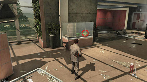 SECRET 7 [Golden Gun - MD-97L Rifle 3/3]: In the destroyed lobby, inside the glass exhibition - Clues and Golden Guns - Chapter VI - Collectibles - Max Payne 3 Game Guide & Walkthrough