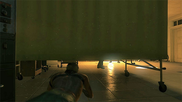 Wait for the enemy to end his search and crawl over to the area that he has been examining - Leaving the hospital | Walkthrough - Mission 0 - Prologue: Awakening - Metal Gear Solid V: The Phantom Pain Game Guide & Walkthrough