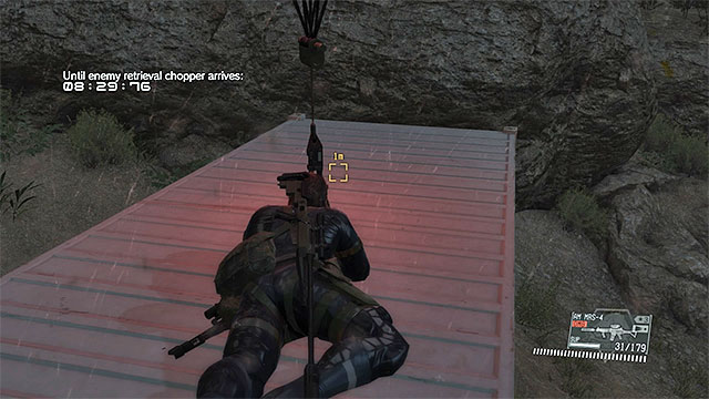 Quickly, lie down onto the roof of the second container - Finding and extracting the two containers | Walkthrough - Mission 36 - Footprints of Phantoms and Mission 37 - Traitors Caravan - Metal Gear Solid V: The Phantom Pain Game Guide & Walkthrough