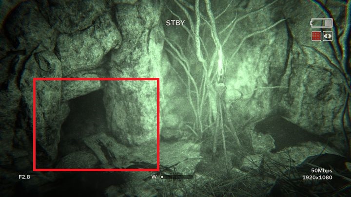 On the left you can see a small hole which is a tunnel that you can crawl into - Descent | Leviticus | Walkthrough - Leviticus - Outlast 2 Game Guide