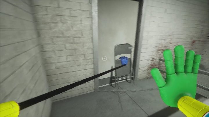 Next, you will go through a staircase until you reach a door blocked by a chair - Poppy Playtime: Wack-A-Wuggy - walkthrough - Chapter 2 - Poppy Playtime Guide, Walkthrough