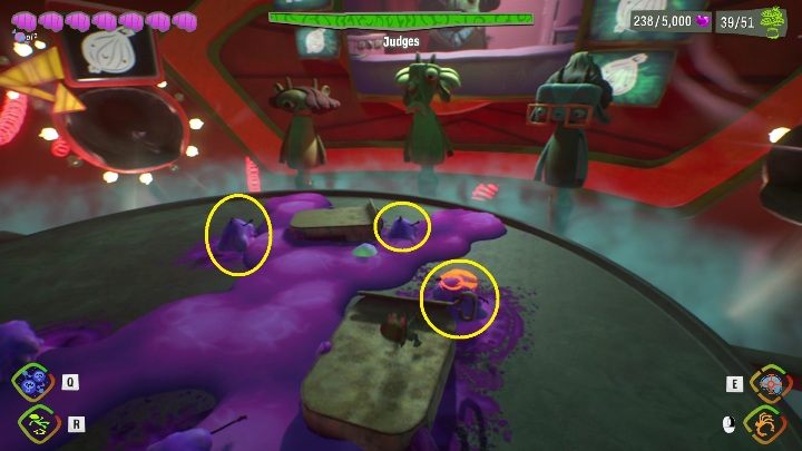 From time to time, the boss in the center will spit out several ingredients covered in sludge - Psychonauts 2: Judges boss fight - how to beat - Bosses - Psychonauts 2 Guide