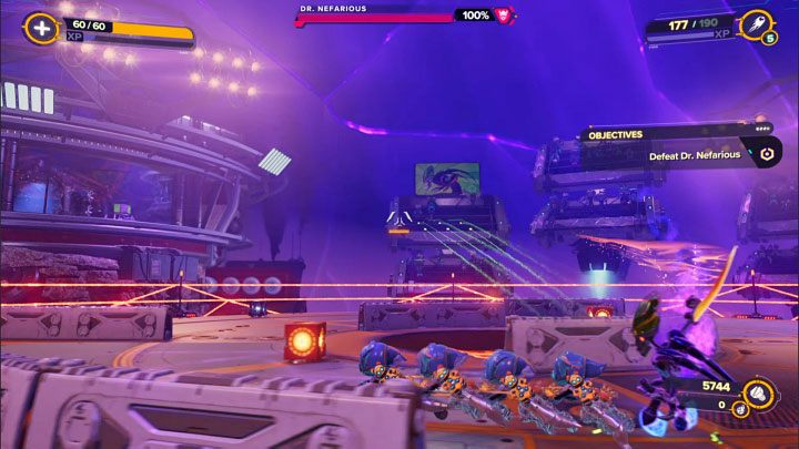 During the first phase (out of four), your task will be to get his health bar down from 100 down to 80% - Ratchet & Clank Rift Apart: Doctor Nefarious, return to the Arena - how to defeat the boss? - Bosses - Ratchet & Clank Rift Apart Guide