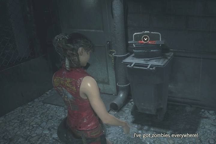 After the cut-scene, take the cutting tool lying on the barrel near the door (the ground floor) - Meet with the visitor (cutting tool) task | Police station in Resident Evil 2 - Walkthrough - Resident Evil 2 Guide
