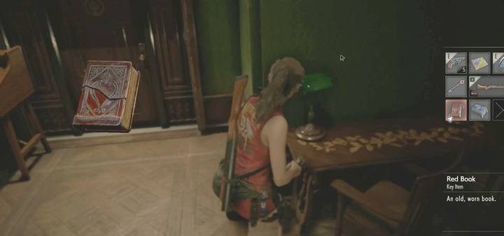 First go to the Library, 2F. At the door leading to the main hall you will find a red book on the table. - How to get the third weapon from the Armory? - Secrets and useful items - Resident Evil 2 Guide