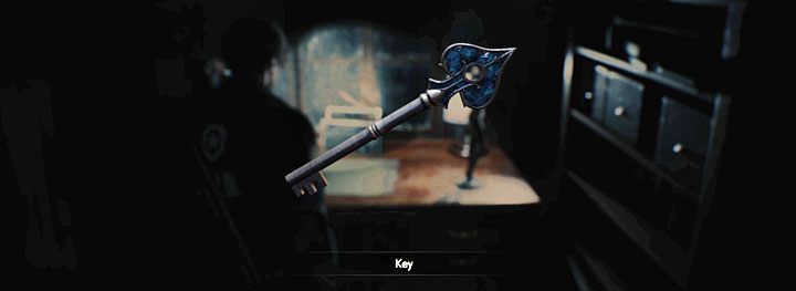 The key lies on the desk next to the radio and the figurine - Where to find the blue key (spades) at the police station in Resident Evil 2? - FAQ - Resident Evil 2 Guide