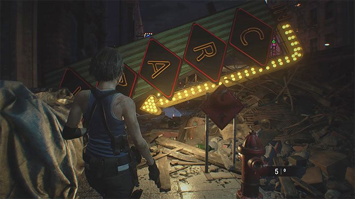 After reaching the side alley, examine the police officers corpse - Jill picks up a G19 pistol - Resident Evil 3: Jills apartment and escape walkthrough - Story walkthrough - Resident Evil 3 Guide