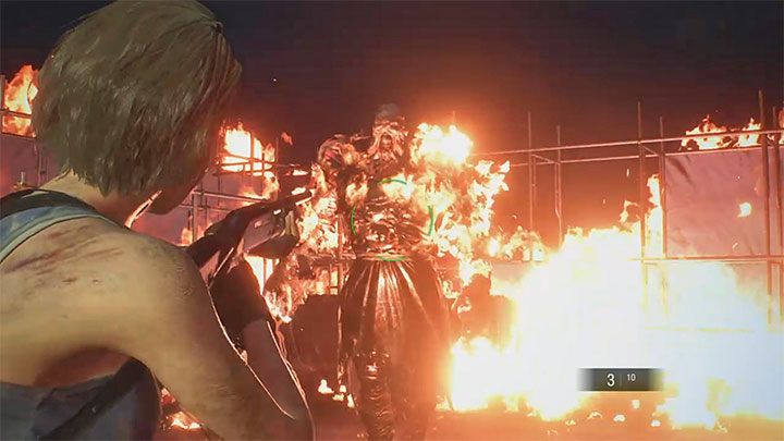 After the fuel tank is destroyed, you advance to the second phase of the fight - you must attack and avoid the burning Nemesis - Resident Evil 3: Nemesis - Demolition Site boss fight - Nemesis boss fights - Resident Evil 3 Guide