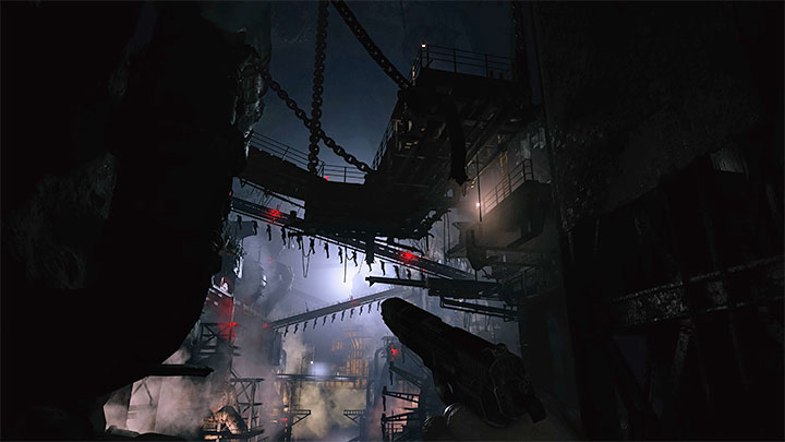 Continue the linear section until you reach the main hall with production lines visible in the distance - Resident Evil Village: Unlocking the factory, finding Heisenberg - walkthrough - Factory - Resident Evil Village Guide