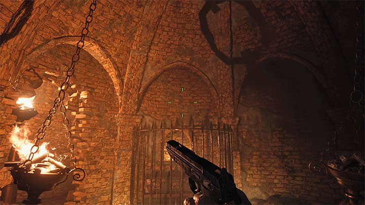 Tearing down the wall will allow you to reach the loot, but more importantly, you can now light up one of the braziers that hang from the chains - Resident Evil Village: Silver Ring and Azure Eye - how to find and combine them? - FAQ - Resident Evil Village Guide