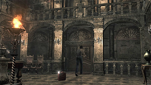 The dining room entrance is to the right of the typewriter, in the vestibule - Saving Rebecca | Training Facility Basement Walkthrough - Training Facility Basement - Resident Evil Zero HD Game Guide & Walkthrough