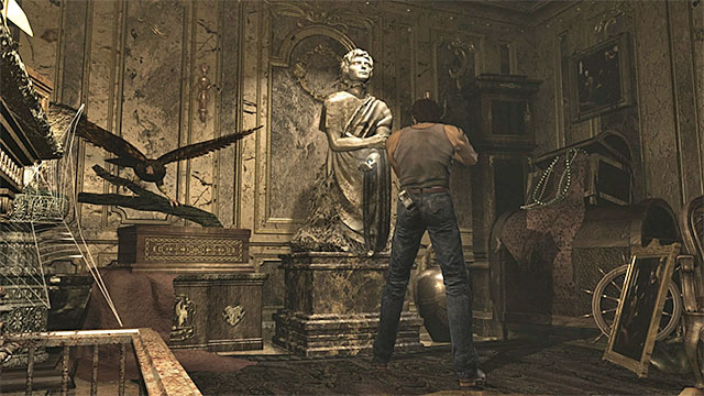 The statue is holding the green charm. - Obtaining the Green Leech Charm | Laboratory Walkthrough - Laboratory - Resident Evil Zero HD Game Guide & Walkthrough