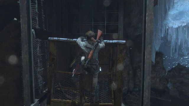 Jump off the ramp, to the ground level and walk onto the lift - Rise of the Tomb Raider: Find a way through the mountain, walkthrough - Shortcut - Rise of the Tomb Raider Guide