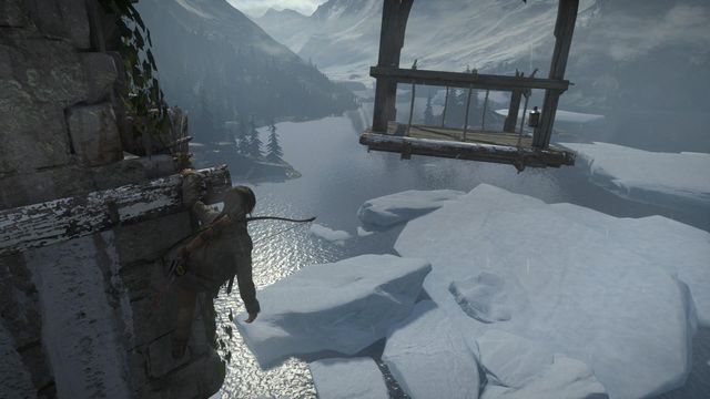The final phase of the climb consists in jumping over towards the wooden lift - Rise of the Tomb Raider: Light the Signal Fire on the Spire, walkthrough - Prepare for Battle - Rise of the Tomb Raider Guide