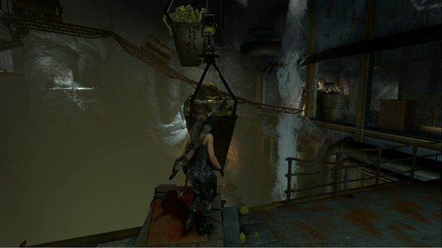 Hang down from the container to lower the cart. - Rise of the Tomb Raider: Tomb - Red Mines 2/9, Soviet Installation secrets - Soviet Installation - Rise of the Tomb Raider Guide
