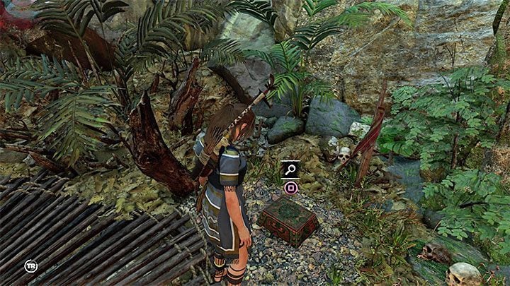 Relic (1) is inside the small chest that lies near rocks, bushes and a wooden construction - Relics in The Hidden City | Secrets in Shadow of the Tomb Raider - The Hidden City - Shadow of the Tomb Raider Game Guide