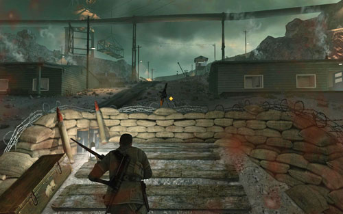 After heading out of the facility, run towards the machine gun [#11] while eliminating a sniper who has appeared on the guard tower - Mission 2 - Mittelwerk Facility - p. 2 - Walkthrough - Sniper Elite V2 Game Guide & Walkthrough