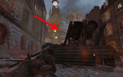 Another sniper is hiding on the church tower, though hes hardly visible because of the smoke - Mission 5 - St. Olibartus Church - p. 1 - Walkthrough - Sniper Elite V2 Game Guide & Walkthrough
