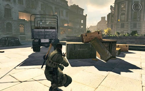 Deeper into the square, right beside some crates by a truck [#5] - Mission 4 | Wine Bottles and Gold Bars - Wine Bottles and Gold Bars - Sniper Elite V2 Game Guide & Walkthrough