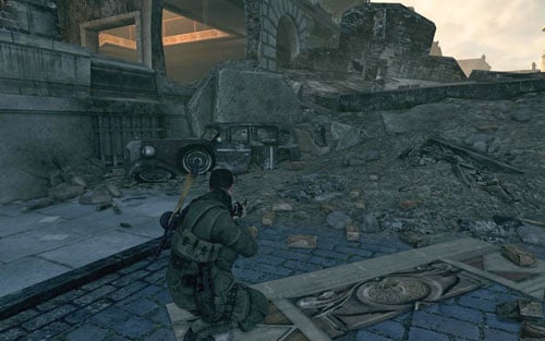 In the right corner of the square, at the back seat of the destroyed car [#7] - Mission 4 | Wine Bottles and Gold Bars - Wine Bottles and Gold Bars - Sniper Elite V2 Game Guide & Walkthrough