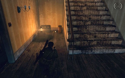 In the same building, on the ground floor right beside the stairs, between suitcases [#3] - Mission 10 | Wine Bottles and Gold Bars - Wine Bottles and Gold Bars - Sniper Elite V2 Game Guide & Walkthrough