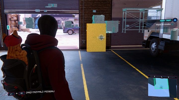 In the garage, scan the surroundings and examine the traces on the floor, then open the cabinet by the entrance and press the button to activate a secret elevator leading to a lower level - Spider-Man Miles Morales: Weve Got a Lead! - walkthrough - Side missions - Spider-Man Miles Morales Guide