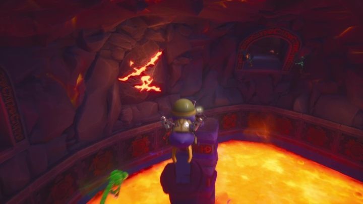 After connecting the heads to all of the statues, you will be asked to destroy some of the rock - Molten Crater | Spyro: Year of the Dragon Walkthrough - Sunrise Spring - Spyro Reignited Trilogy Guide