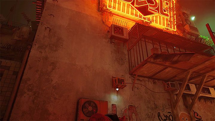 Reach the area under the large neon sign - there are 2 robots in this area throwing paint cans - Stray: The Slums, Chapter 4 - walkthrough - Walkthrough - Stray Guide, Walkthrough