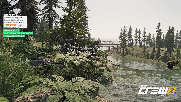 Description: Stand at the Edge of Seaside Waterfall near White Mountains with a Motocross vehicle (north of New York) - The Crew 2: Album - Off-Roadin - The Crew 2: Photo Ops - The Crew 2 Game Guide